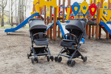 Beautiful baby carriage in the park. New design.
