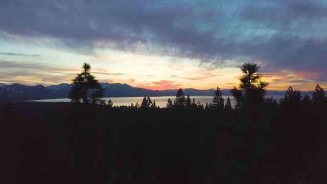 286 Lake Tahoe aerial sunset revealing through tree silhouettes