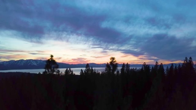 285 Lake Tahoe aerial sunset revealing with tree silhouettes
