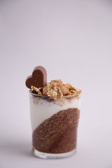 Delicious breakfast, cocoa chia pudding with yogurt and cereals