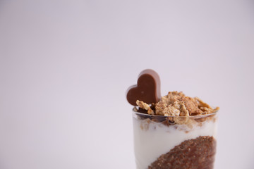 Delicious breakfast, cocoa chia pudding with yogurt and cereals