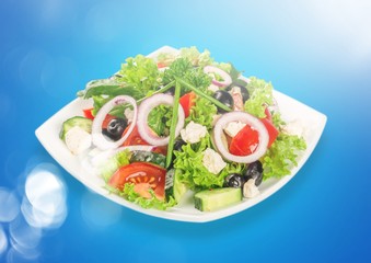 Fresh tasty vegetable salad in bowl on white background