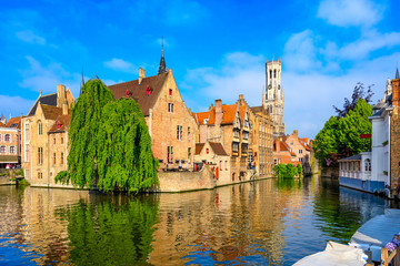 Fototapeta na wymiar Classic view of the historic city center with canal in Brugge, West Flanders province, Belgium. Cityscape of Brugge.