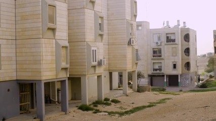 Row of old housing projects in an Israeli city located in the Negev desert