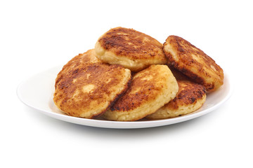 Cottage cheese pancakes, close-up, isolated on white background