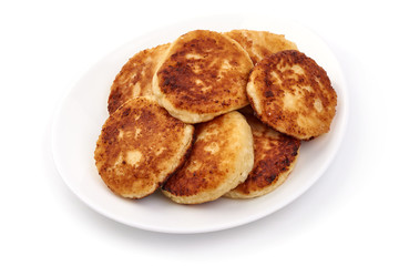 Cottage cheese pancakes, close-up, isolated on white background