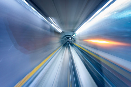 Abstract Motion Blurred of Metro Transportation Tunnel in Speed Movement Shot, Moving Fast Defocus Blur in Underground Subway Track. Urban Railway Public Transport