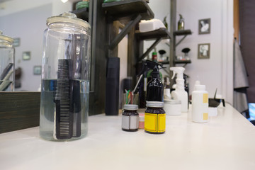 comb in a jar of water. hairdresser's office