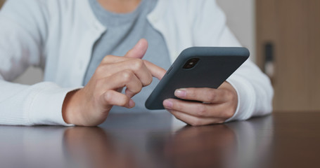 Woman use of smart phone at home