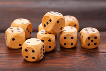 Dice on wooden table. Background for casino games.