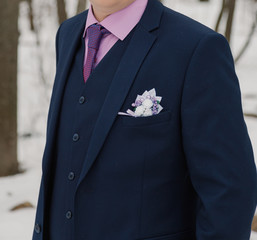 Business young man in a jacket on the street.