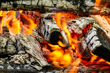Cooking coals for cooking barbecue on the grill. Selective focus. Beautiful bonfire of burning oak...