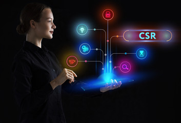 The concept of business, technology, the Internet and the network. A young entrepreneur working on a virtual screen of the future and sees the inscription: CSR