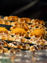 Various flavored waffles that are placed for sale in the Thai Street Food Market