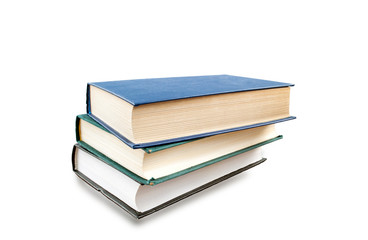 Books stacked up vertically isolated on white. Education concept.