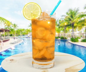Lemonade with fresh lemon on  background