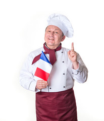 Chef with a flag of France on a light background. Middle aged man. Portrait happy cook showing finger up. Good idea.