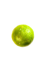 Isolated Green lemon or lime with white die cut background with green and yellow texture skin.