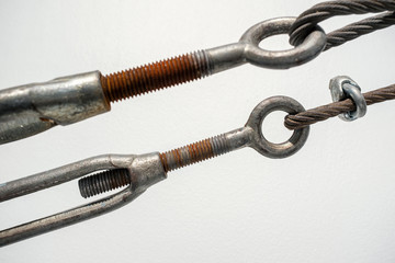 detail of rusty sling and hook, shallow depth of field