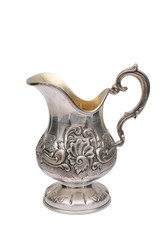 An antique jug of silver on a white background.