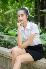 Portrait of thai adult student university uniform beautiful girl relax and smile