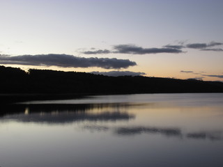 Fototapeta premium Reflection of the sky on the lake water during sunset