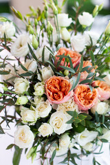 The composition of fresh flowers on the table. The decor of the Banquet in the restaurant flowers. Selective focus.