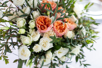 The composition of fresh flowers on the table. The decor of the Banquet in the restaurant flowers. Selective focus.