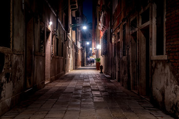 Fototapeta na wymiar Typical street in Venice in winter's night with long exposure
