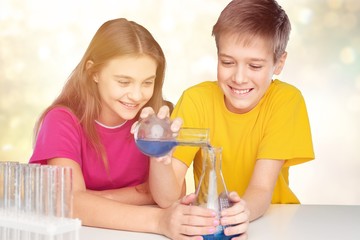 Obraz na płótnie Canvas Happy children studying science on background