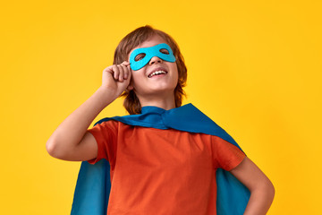 Confident superhero adjusting mask © kegfire