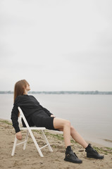 Stylish girl posing in stylish clothes