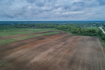Aerial photography with a drone. Landscape with a road and a field.