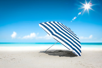Summer umbrella on beach and sun light. Free space for your decoration and ocean landscape 