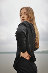 Stylish girl posing in stylish clothes