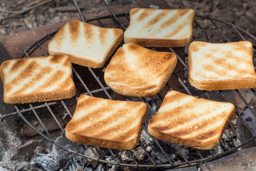 Cooking grilled toast on the coal grill