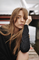 Stylish girl posing in stylish clothes