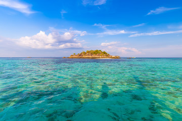 Clear water and beautiful sky at the paradise island in the tropical sea of Thailand