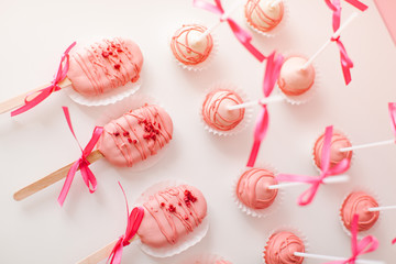 cake popsicle on a pink background