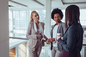 Enjoying coffee with colleagues