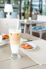 latte coffee glass on table in cafe restaurant