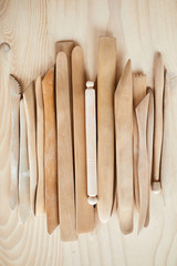 Top view background of carving tools on wooden table, copy space