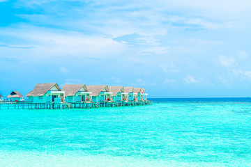 Beautiful tropical Maldives resort hotel and island with beach and sea