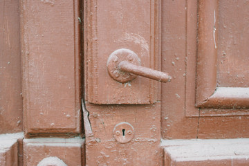 door knob on the old red door 