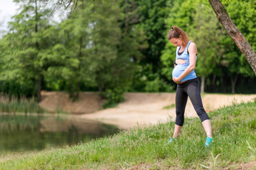 Pregnant woman fitness exercises outdoor