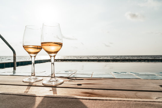 Whiskey Glass With Swimming Pool And Sea Background