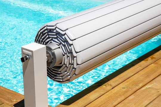 pool shutter to conserve heat and protect from accidental falls