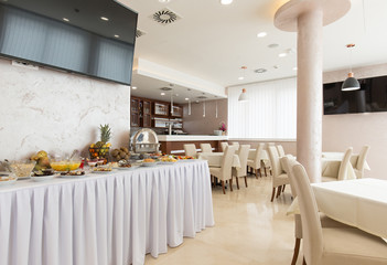 Breakfast buffet table in hotel restaurant
