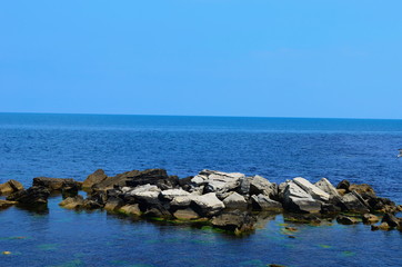 Crystal blue Black Sea and stones in Bulgaria, Nessebar island