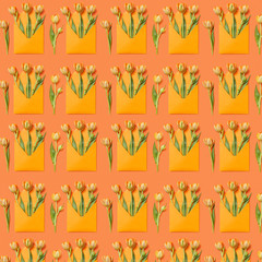 Decorative pattern with gift envelopes of tulips flowers on an orange.